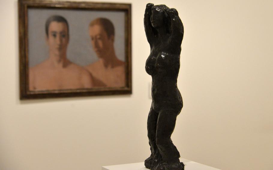 Jean Fautrier's "Large Standing Nude" from 1928 and Leon Zack's "Double Portrait of Two Men" from 1931 are on display in the tunnel that connects the two buildings that make up the Unterlinden Museum in Colmar, France.