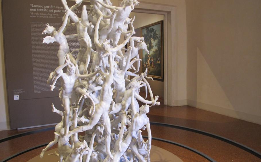 Rebel angels tumble to Hell in a marble sculpture at the Gallerie D'Italia-Palazzo Leoni Montanari. 