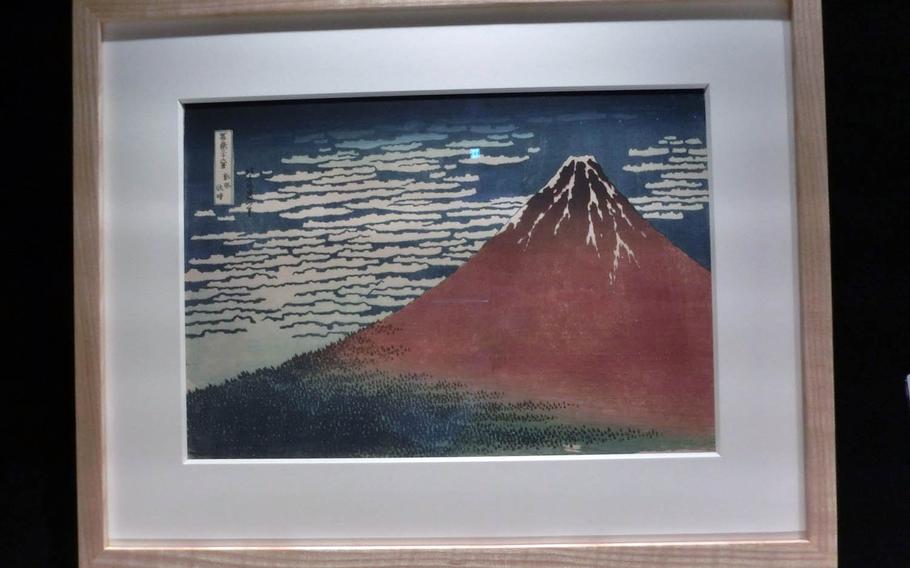 A replica of "South Wind, Clear Skies" by Katsushika Hokusai is displayed at the Sumida Hokusai Museum in Tokyo.