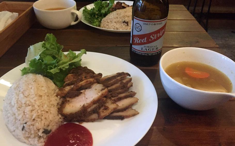 Jerk chicken and pork at the centerpeice lunchtime dishes at Good Wood Terrace in Tokyo.