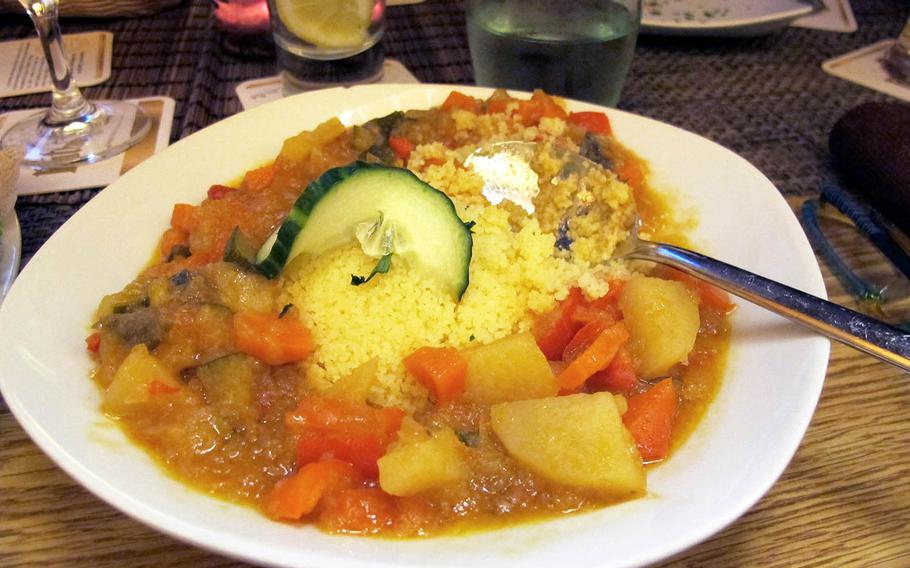 A dish of couscous and vegetables at Safari is eaten with a spoon, flat bread or fingers. 
