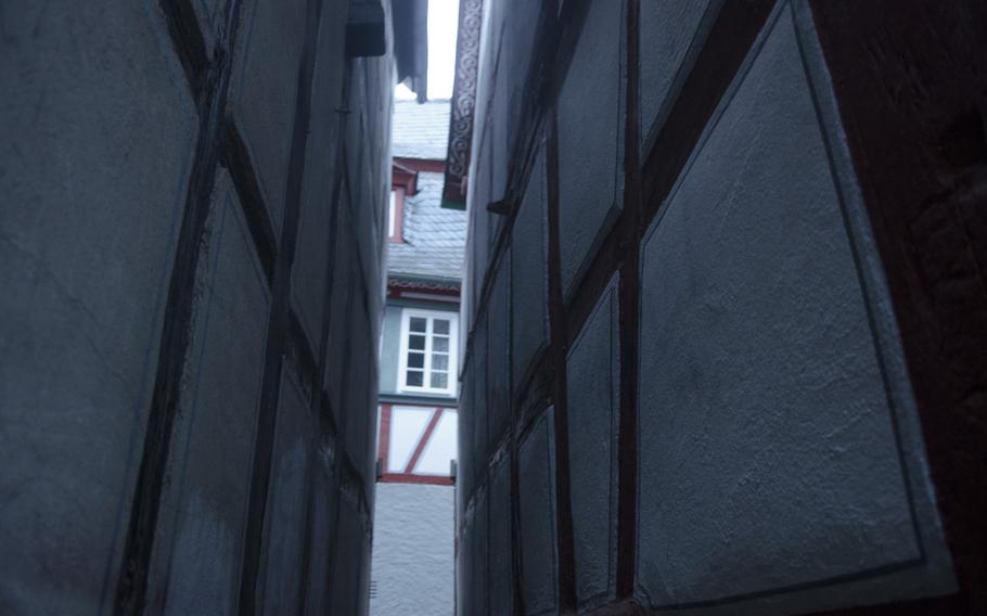 A glimpse at a narrow alley, enough for one person to pass through at a time, shows that the history of Bacharach, Germany, reaches far past the dawn of automobiles.