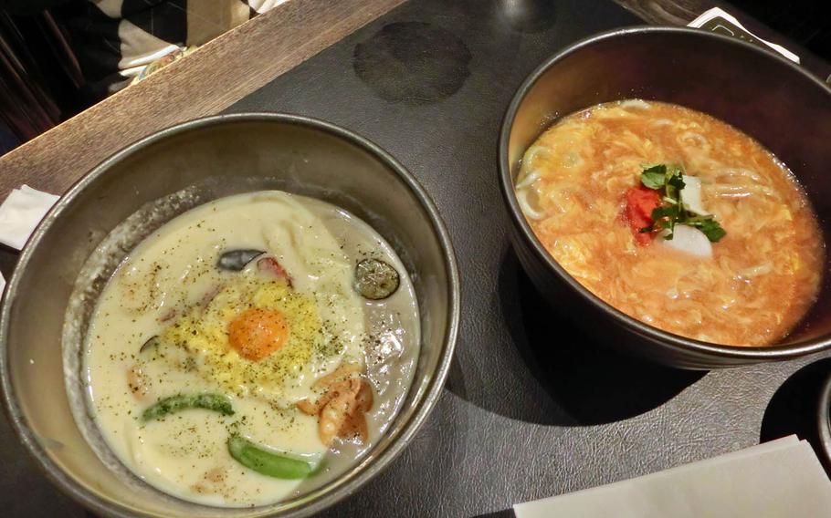 Carbonara udon, left, and mentaiko and egg ankake udon are served in large bowls at Tsuru Ton Tan in Tokyo.