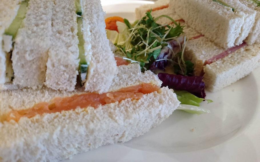 Smoked salmon, cucumber and cream cheese and Suffolk ham sandwiches from an order of special afternoon tea at Harriets Cafe Tearooms in Bury St. Edmunds, Suffolk, England. Afternoon tea ranges costs 16.95-25.95 pounds per person ($21-32). 
