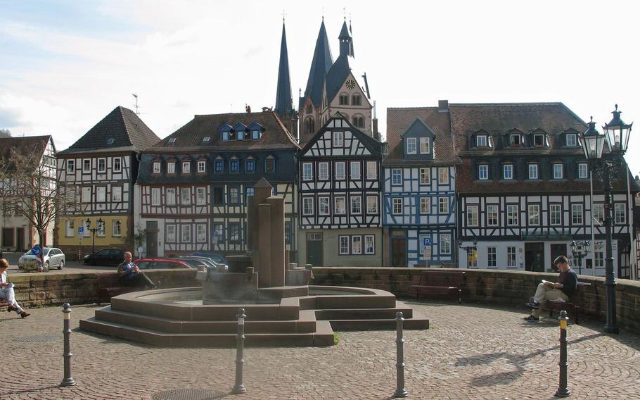 A view of the Obermarkt in Gelnhausen, Germany, with its row of half-timbered houses. In the background is the Marienkirche, or St. Mary's Church.