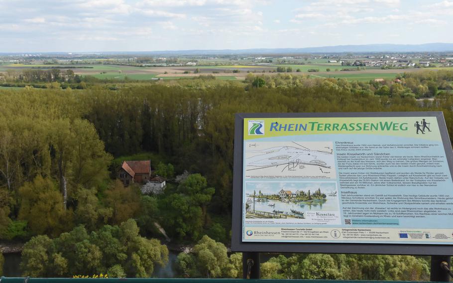 A sign in German at a lookout above the Rhine River valley describes the River Rhine Terrace Trail,  a 37-mile footpath through vineyards and historic villages in Germany's largest wine region, between Worms and Mainz.
