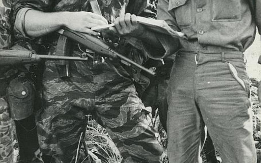Barry Sadler in camouflage fatigues, on patrol with the Montagnards in Vietnam.