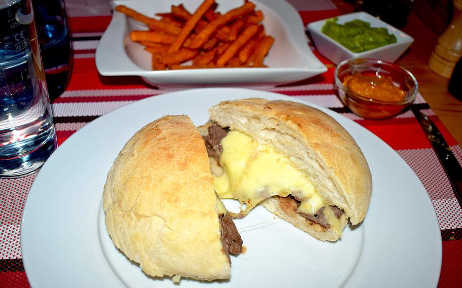 The simple menu at Chacarero Steakhouse in Einsiedlerhof, Germany, is comprised mostly of Argentinian beef options. Pictured is the Barros Luco, a straightforward combination of beef and cheese on warm bread.