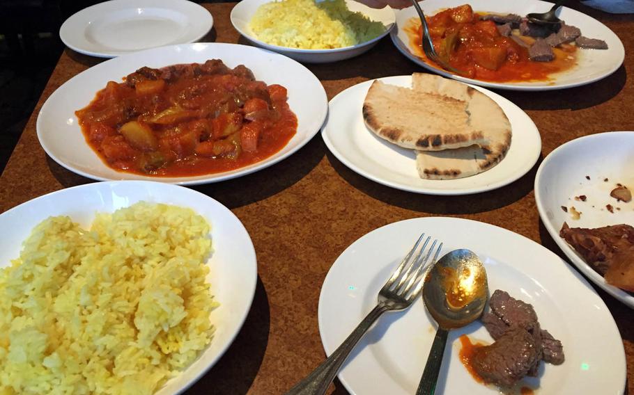 Ostrich steak and lamb stew dishes from Safari in the Akasaka district of central Tokyo.