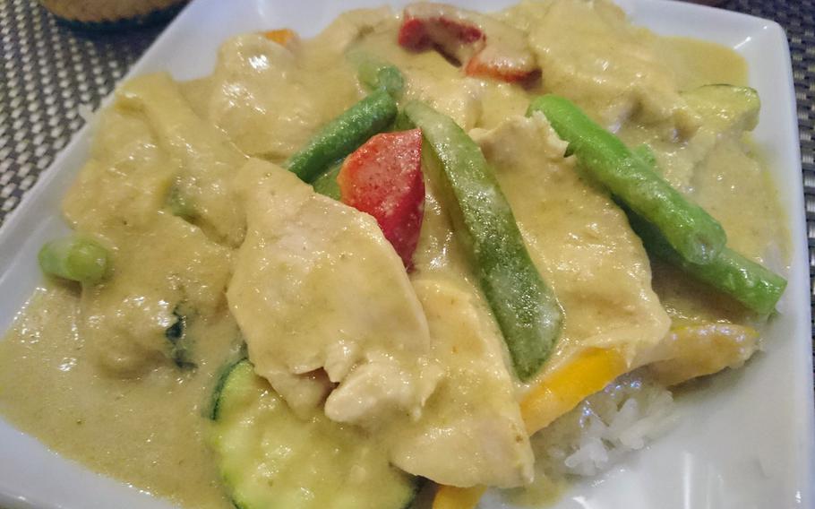 Thai green curry over sticky rice at the Giggling Squid restaurant in Bury St. Edmunds, Suffolk, Tuesday, May 2, 2017. Green curry is a Central Thai variety of curry.