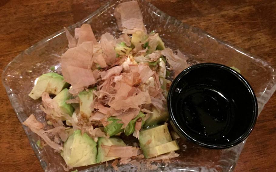 Ibushi Ginjiro's appetizer of avocado, cream cheese, soy sauce and wasabi, topped with dried fish shavings, is an interesting combination.