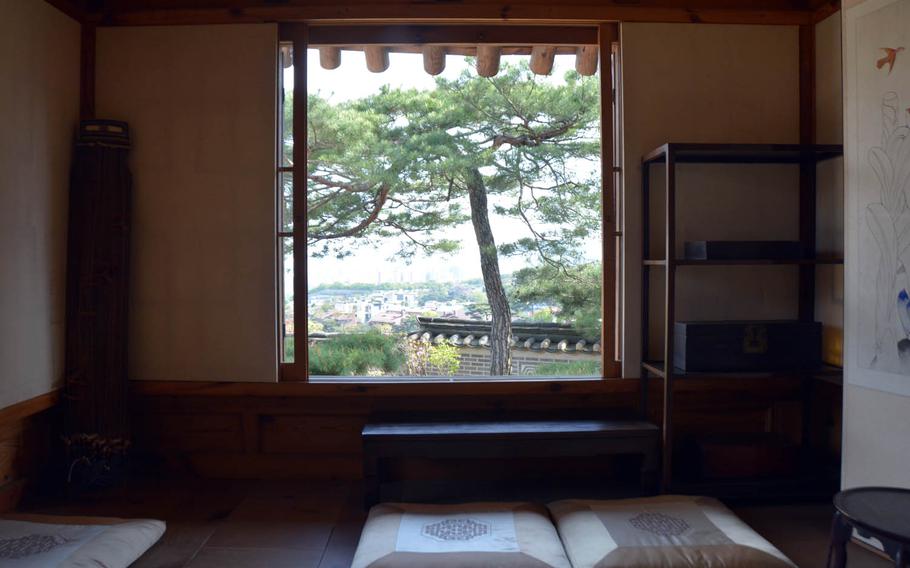 A view of Seoul as seen from inside the women's quarters in the nobleman's house at the Korea Furniture Museum.