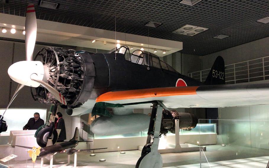 A restored Zero fighter plane flown by the Japanese Imperial Navy during World War II is displayed at the National Museum of Nature and Science in Tokyo.