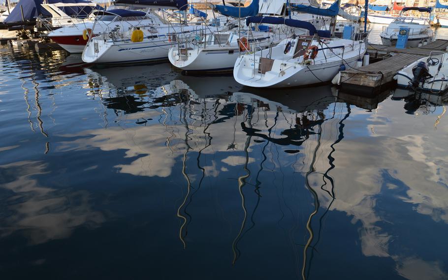The sky is reflected in the waters of Chania, Crete's Venetian Harbor.