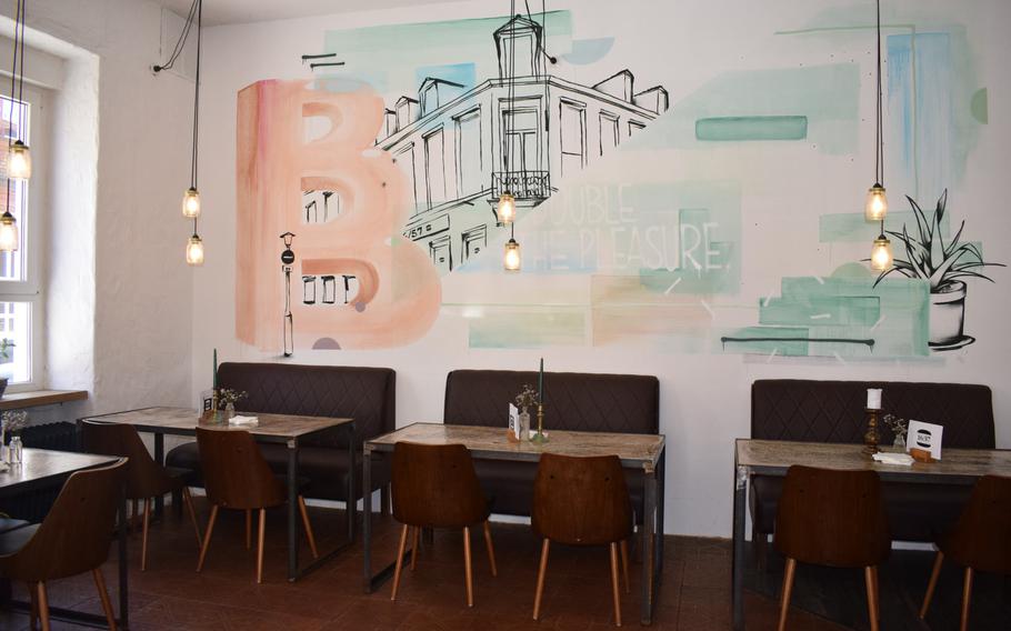 The interior of Burger 16/57 in Kaiserslautern, Germany, is an appealing mix of an old structure and sleek, modern surfaces.