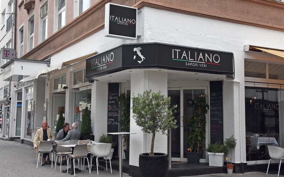 Diners sit outside Italiano Sapori Veri on a recent summery day in Kaiserslautern, Germany.