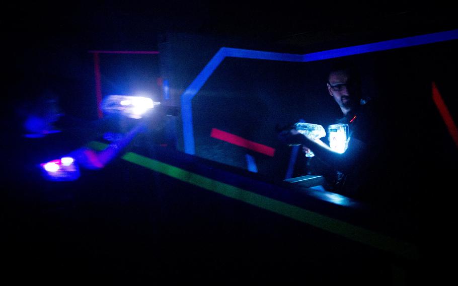 Hendrik Triepel, right, is ambushed during a round of laser tag at Laserforce in Kaiserslautern, Germany.