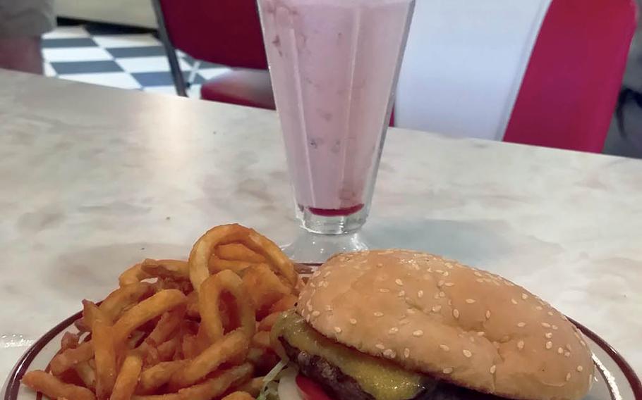 A Route 16 burger with curly fries and a strawberry milkshake from the Route 16 diner at Yokota Air Base, Japan.  