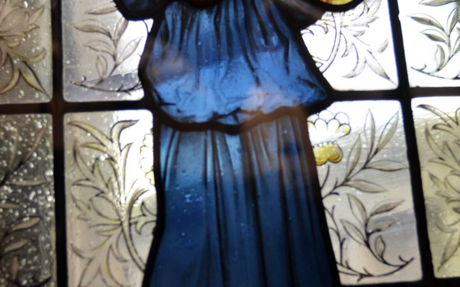 A stained-glass window from a collection titled "Minstrel Figures with Shawn and Cymbals," designed by William Morris in 1875, at the Birmingham Museum and Art Gallery in Birmingham, England.