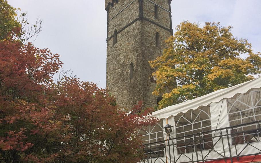 A view of the beer garden and observation tower at Berggasthof Kellerskopf, a rustic restaurant set in the wooded hills outside of Wiesbaden, Germany. Located in the midst of several major hiking and biking trails, the restaurant welcomes hikers and bikers to sit in its beer garden after a long workout.