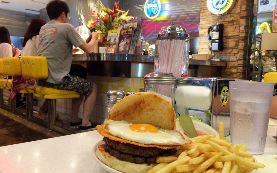 The Dead Moon Burger is the No. 1 item on MOON Cafe's menu. This basic burger, which comes with fresh, thin, crunchy fries, is pretty plain; however, you can add items such as crispy cheese, egg, bacon, onion and mushrooms for an additional charge.