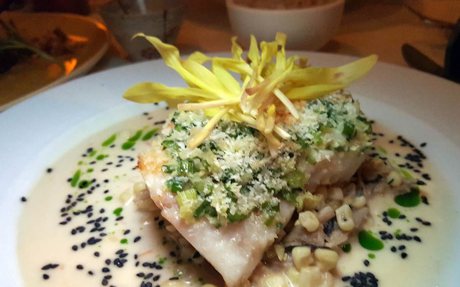 Alan Wong's ginger-crusted onaga, capped with a miso-sesame vinaigrette and surrounded with mushrooms and corn, has been on the menu since the Honolulu restaurant opened in 1995.