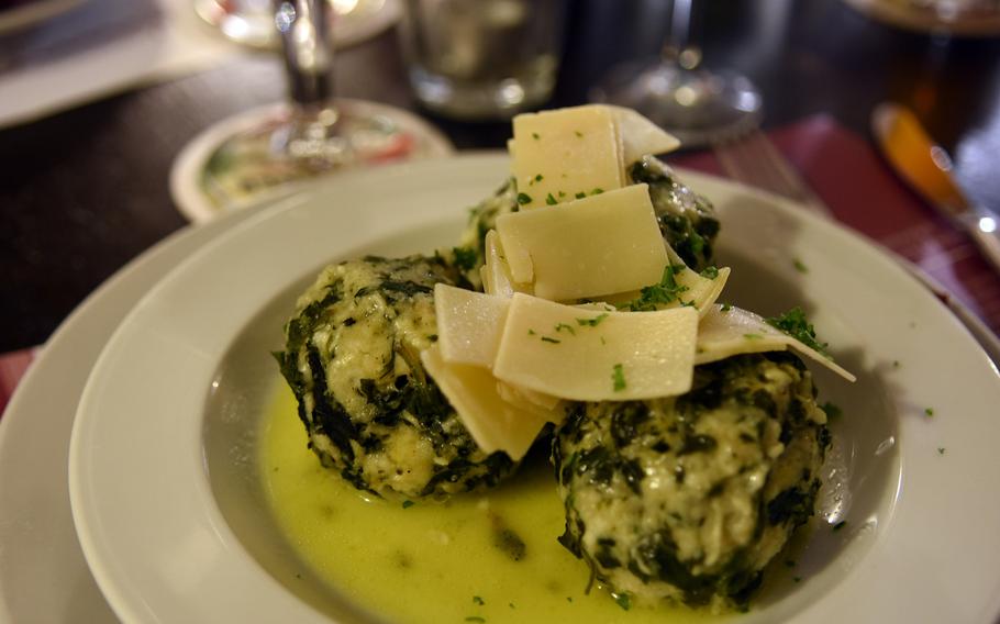 Spinach dumplings topped with thin slices of Parmesan cheese is one of several vegetarian offerings at Spinnraedl, a German restaurant in downtown Kaiserslautern known for its meatier regional specialties. 