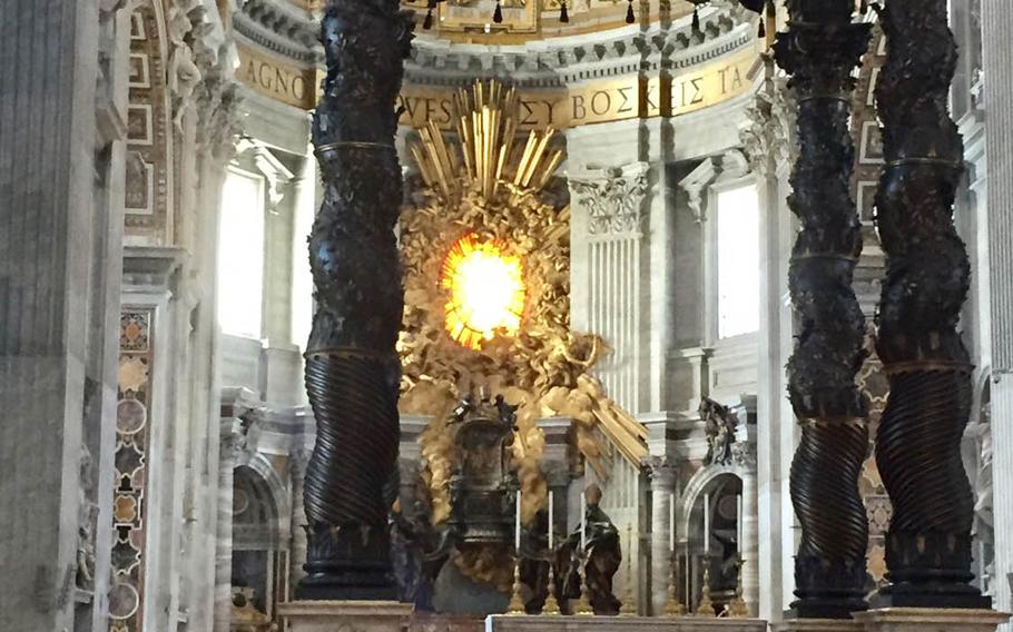 The brass canopy covering the high altar and the Chair of St. Peterare under the massive dome. They make up the centerpiece of St. Peter's Basilica.  