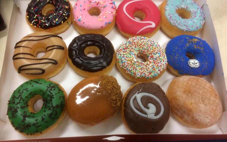 A box of a dozen colorful doughnuts from the new Dunkin' Donuts location in Kaiserslautern, Germany.