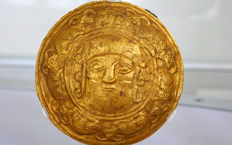 This piece of gold jewelry depicts a male head. It was found in northern Iran and dates back to late 2nd century or early 1st century B.C. It is on display at the Archaeological Museum in Frankfurt, Germany.
