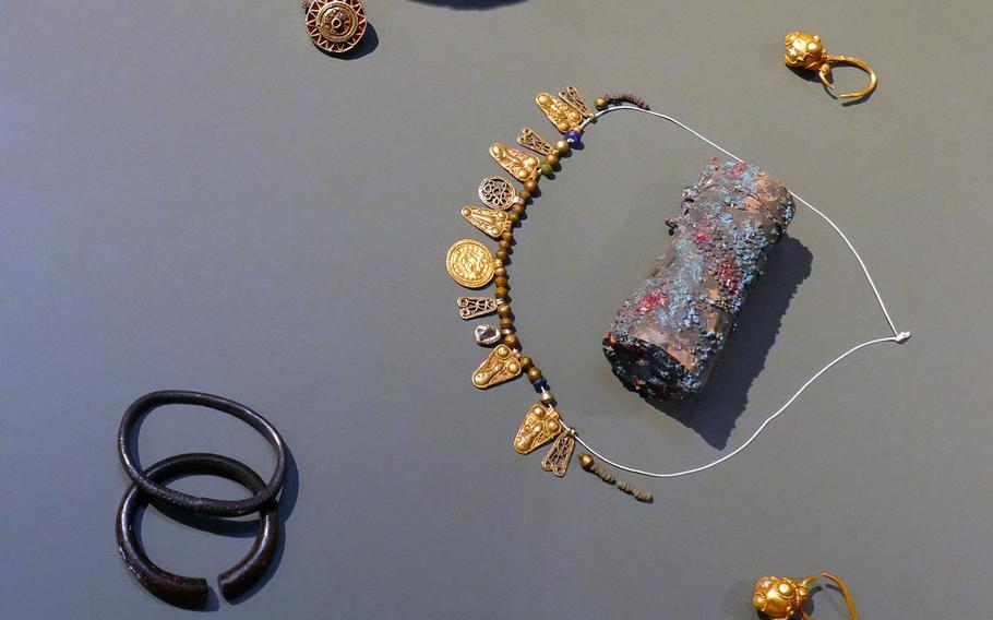 These items, including rings, bracelets, a necklace and a small ornate container, were found in a child's grave under the Frankfurt cathedral and are on display at the Archaeological Museum in Frankfurt, Germany.