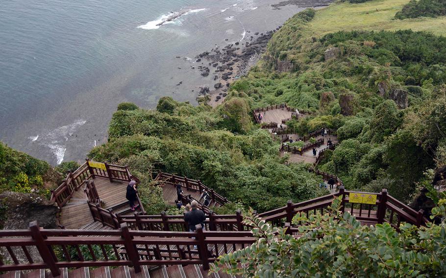 Tourists descending on Seongsan Ilchulbong, also called Sunrise Peak, which was created by a volcanic eruption under the sea. It was a stop on the UNESCO World Heritage tour on Sunday, Oct. 15, 2017, on Jeju Island, off the southern tip of South Korea.