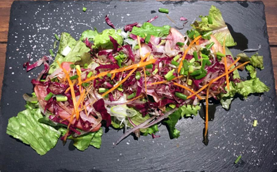 Smoke Camp's smoked duck salad with green onions is afforable, delicious and enough for two.