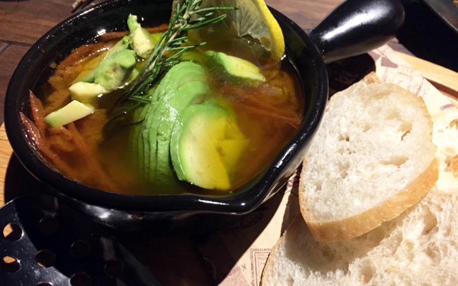 Smoke Camp's tomato and avocado ajillo sings from atop thinly sliced Italian bread.
