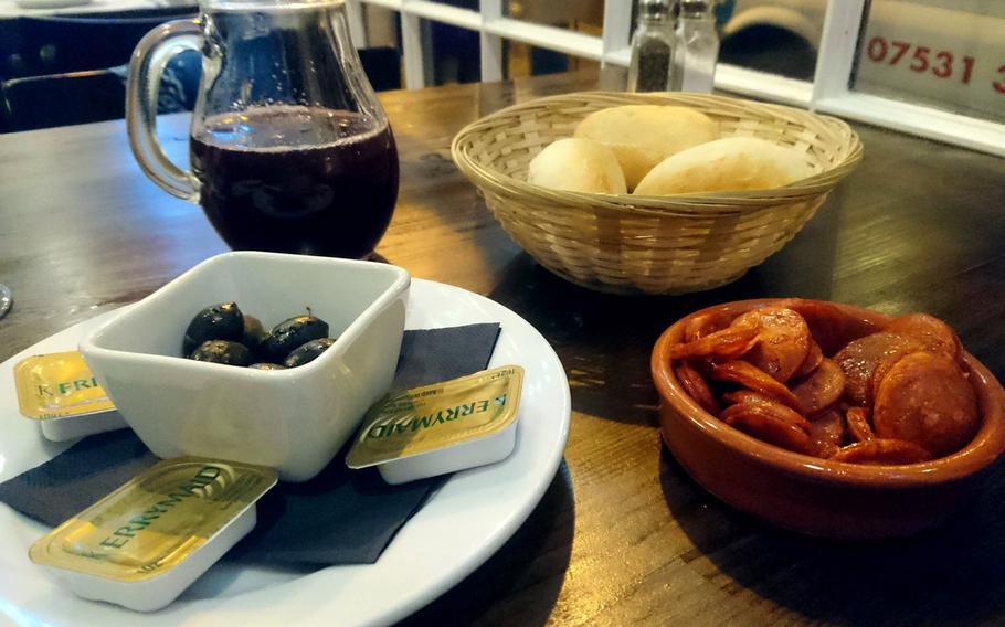 The bread, olive and chorizo sausage appetizer offered with the all-you-can-eat menu.