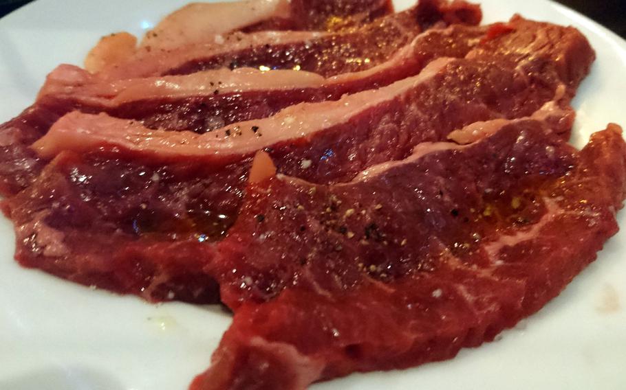 A plate of raw seasoned rump steak offered with the all-you-can-eat menu at the Cheers Steakhouse in Bury St. Edmunds, England, Tuesday, November 28, 2017.  Restaurant owners Andrea and Mario Marinho came up with the idea of offering the traditional Brazilian dish where beef is self-cooked at your table on a very hot stone in 2010.