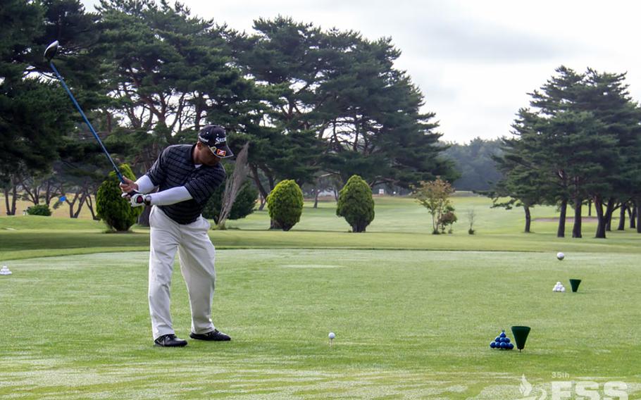 A golfer tees off during a 2016 tournament at Misawa Air Base's Gosser Golf Course.