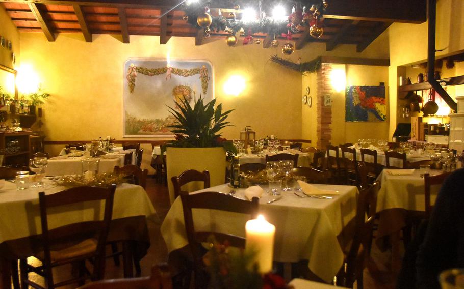 La Casa Gialla, outside Prata di Pordenone, Italy,  literally lives up to its name - yellow house. It features a main dining room that sits about 80  people and has more room upstairs when it gets busy.