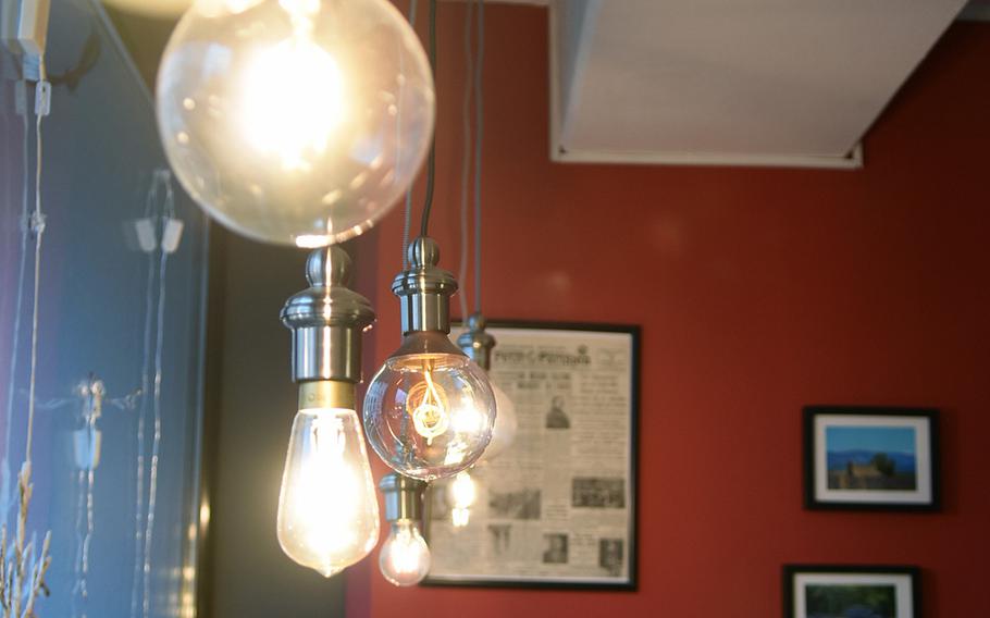 Interesting lamps hanging from the ceiling inside Le Petit Frederic add to the charm of the small cafe.