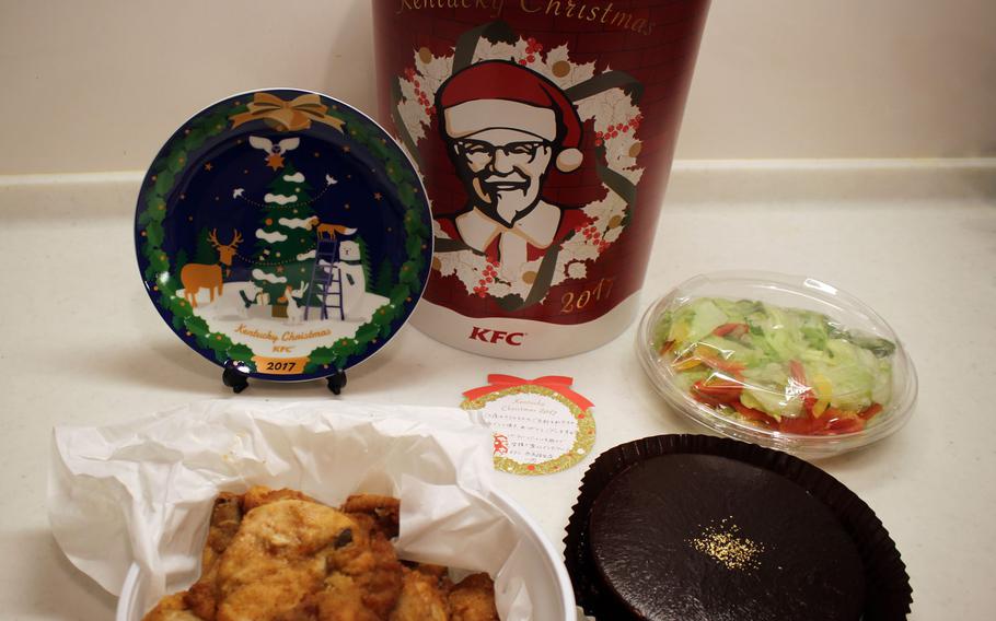 The Christmas bucket from KFC Japan included fried chicken, salad, chocolate cake and a plate to commemorate the holiday.