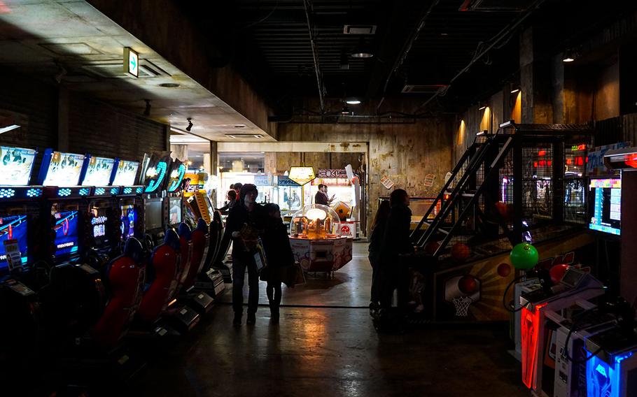 Anata No Warehouse in Kawasaki, Japan, features an extensive collection of arcade machines, such as these racing and shooting games.