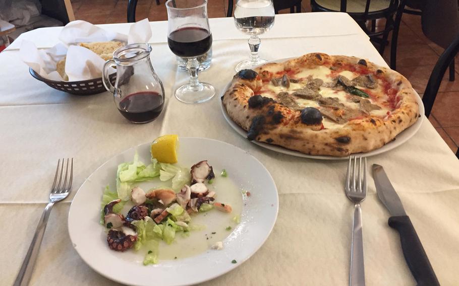 At the Pizzeria Trattoria Lucrino in Pozzuoli, Italy, you can have a very Italian combination of octopus salad, pizza and wine and at a reasonable price. 