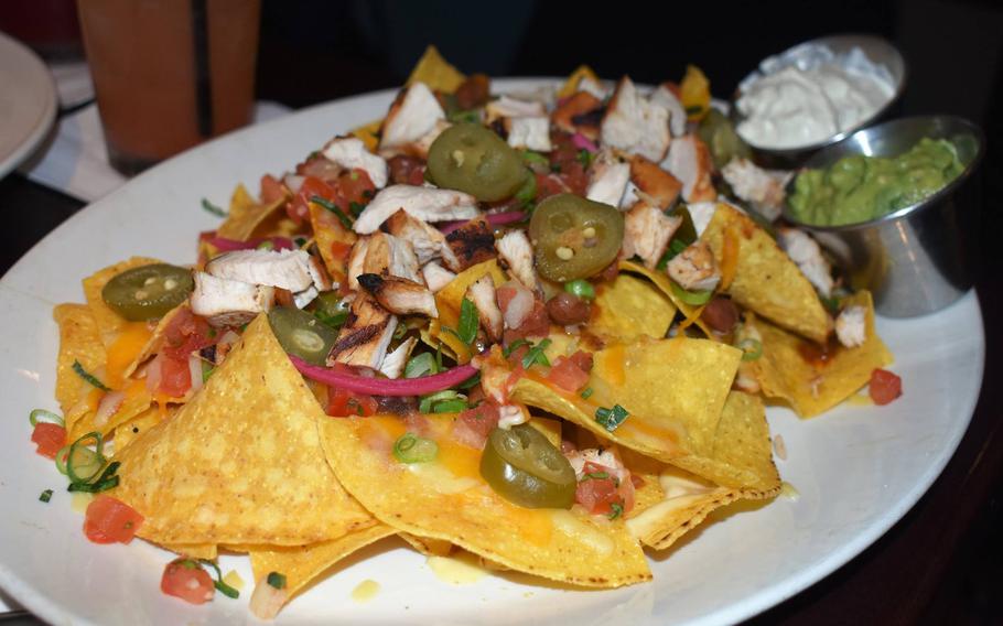 Starters like this plate of nachos offer a good option to keep the tab under control. The generous appetizer is a few pounds cheaper than a burger and many other entrees.