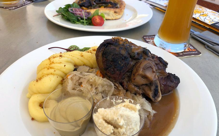 The pork knuckle and vegetable tart at Brovaria in Poznan, Poland, are great choices for lunch or dinner.