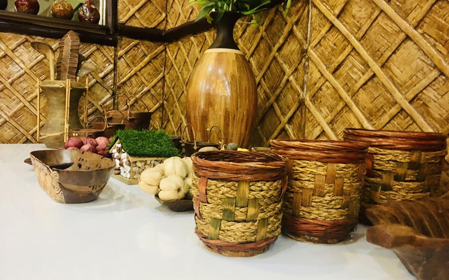 Handicrafts from Philippines decorate the Bahay Kubo restaurant in Manama, Bahrain. The name of the restaurant, which serves delicious, authentic Filipino food, means "nipa hut," a small house on stilts that is representative of the culture of the archipelago  nation.