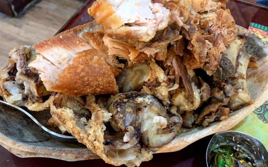 Filipino crispy pata, a deep-fried pork knuckle, will feed four people at Bahay Kubo restaurant in Manama Bahrain. Bahrain is home to more than 40,000 Filipino nationals and dozens of authentic pinoy eateries can be found in Manama.