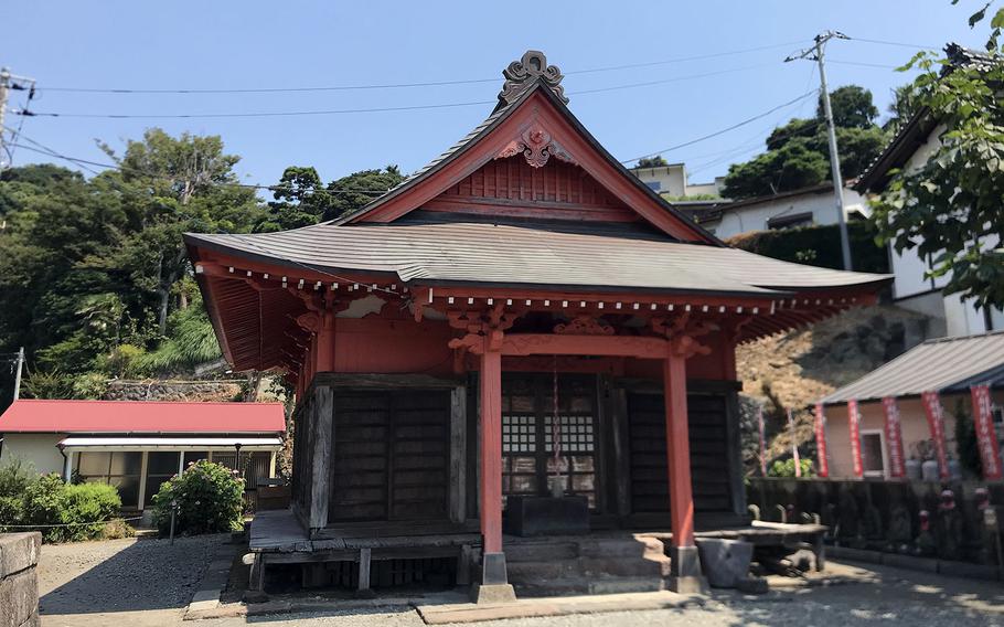 This shrine to a guardian deity of children is among a number of shrines near Yugawara Beach in Kanagawa prefecture, Japan. 