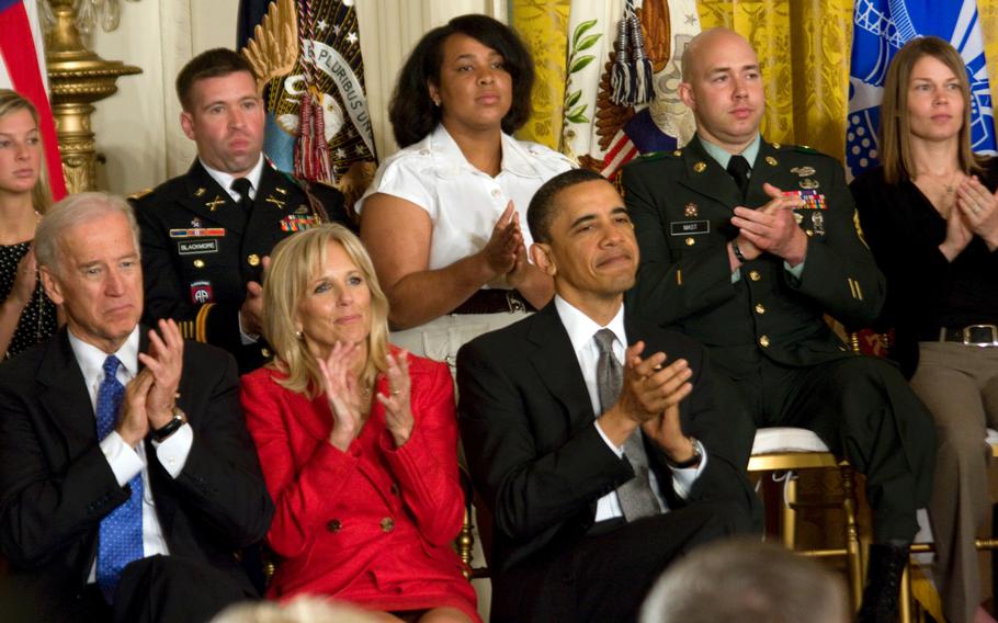 President Barack Obama, Vice President and Mrs. Joe Biden and members of military families applaud as first lady Michelle Obama announces the new Joining Forces campaign Tuesday at the White House.
