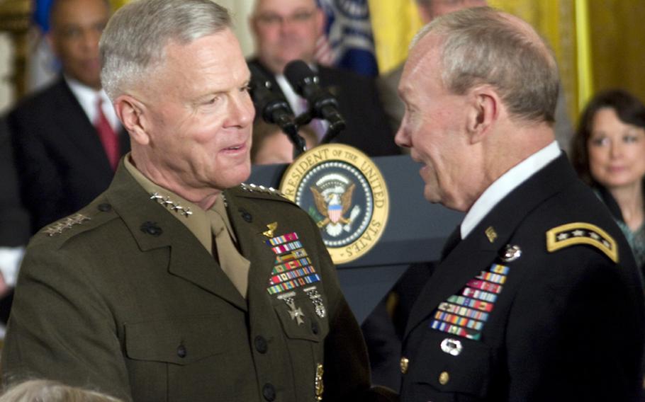 Marine Corp Commandant Gen. James F. Amos, left, talks with his new Army counterpart, Gen. Martin E. Dempsey, April 12, 2011, at the White House.