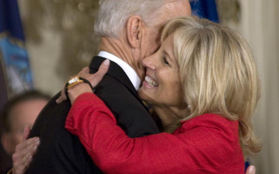 Vice President Joe Biden gets a hug from his wife, Dr. Jill Biden, after he introduced her at Tuesday's White House event.